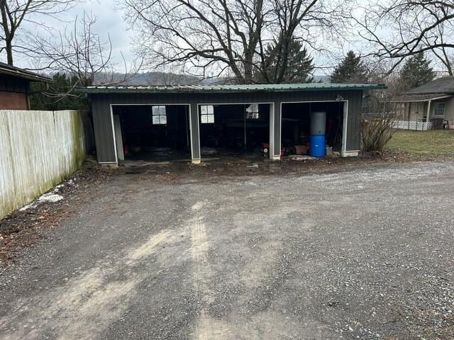 garage with fence