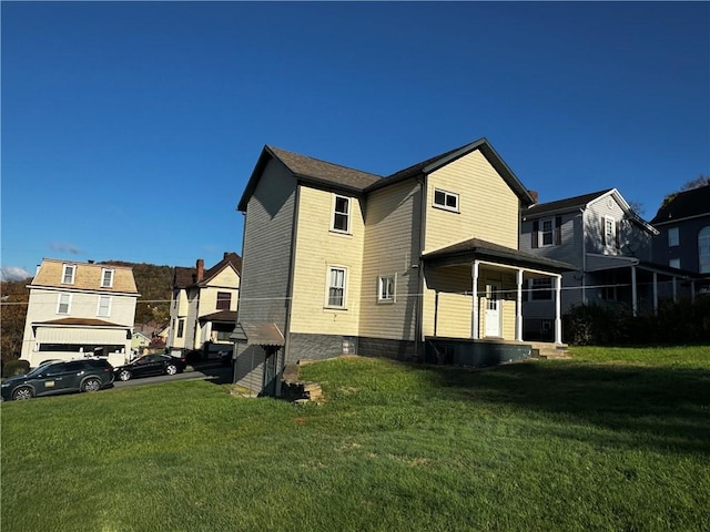 view of side of home featuring a yard