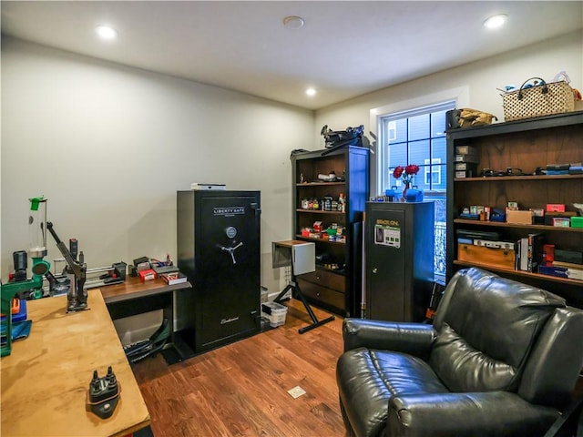 interior space with wood finished floors and recessed lighting