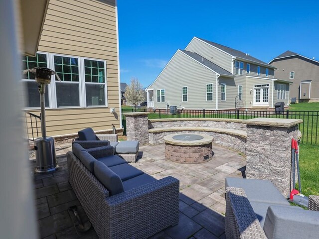 view of patio with fence and an outdoor fire pit