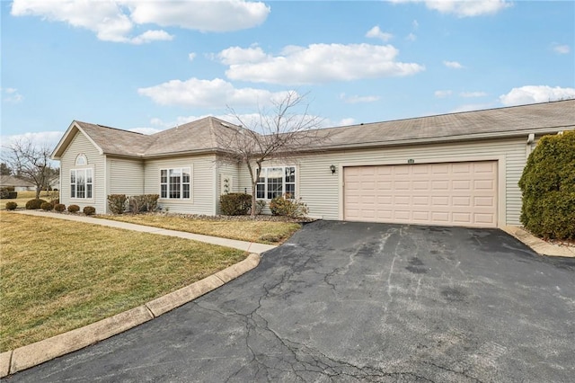 single story home featuring driveway, a front lawn, and an attached garage