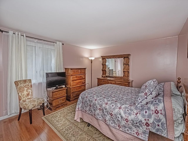 bedroom with light wood-style flooring