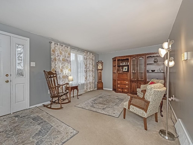 sitting room featuring carpet flooring, visible vents, and baseboards