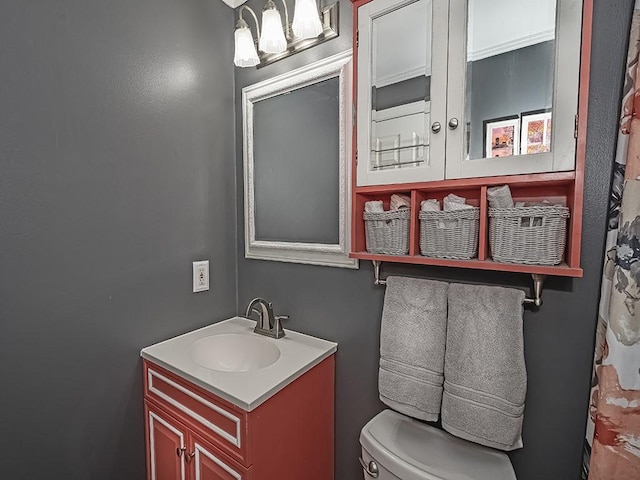 bathroom featuring vanity and toilet