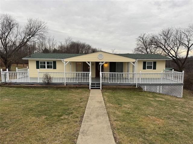 ranch-style house featuring a front lawn and a porch