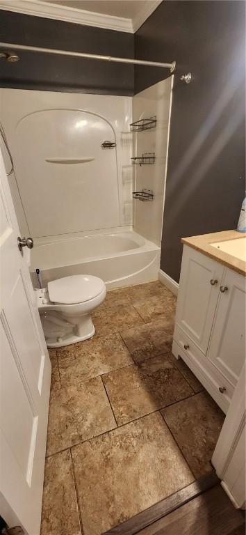 bathroom with toilet, bathing tub / shower combination, and vanity