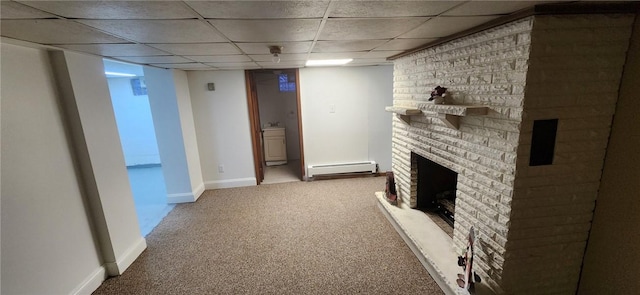 living area featuring carpet floors, a baseboard radiator, a paneled ceiling, a brick fireplace, and baseboards