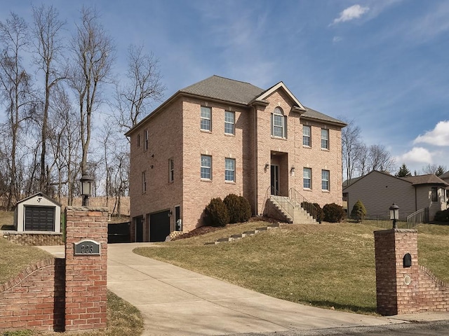 view of front of house with a front yard, brick siding, and driveway