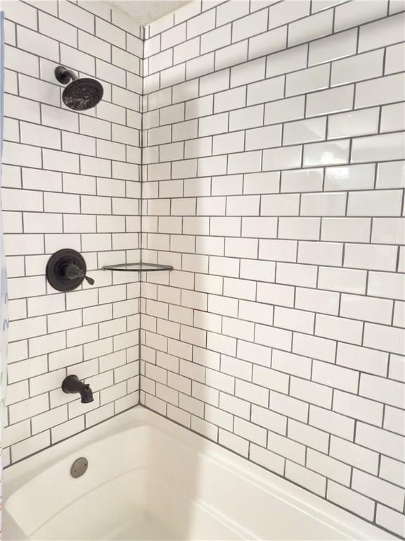 full bathroom with shower / tub combo