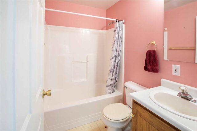 bathroom with vanity, toilet, and shower / bath combo with shower curtain