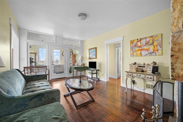 living area featuring wood finished floors and baseboards