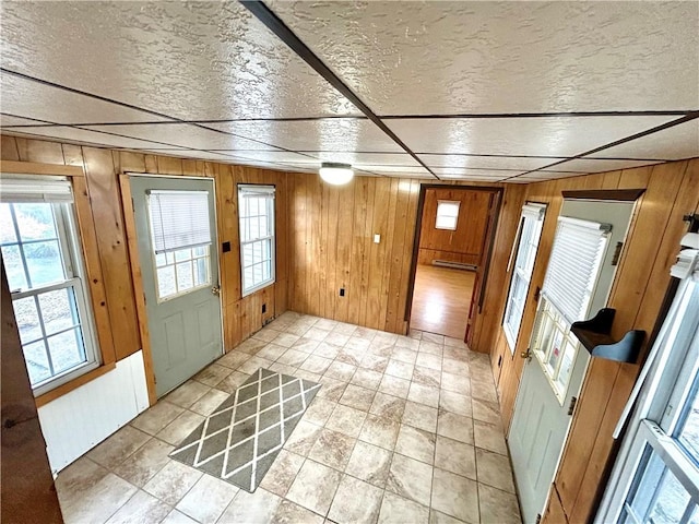 doorway featuring wooden walls