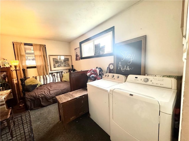 clothes washing area featuring laundry area, carpet flooring, and washing machine and clothes dryer