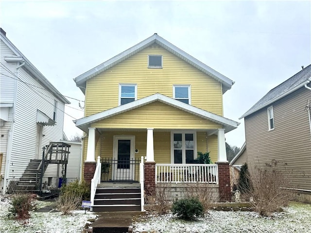 view of front facade featuring stairs and a porch