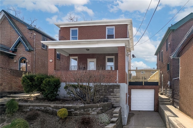 view of front of property featuring a garage, concrete driveway, and brick siding