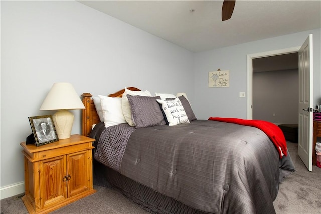 bedroom featuring light carpet, ceiling fan, and baseboards