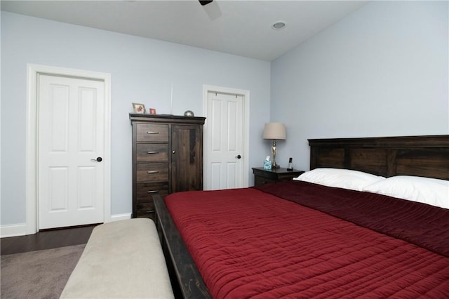 bedroom with a ceiling fan and baseboards