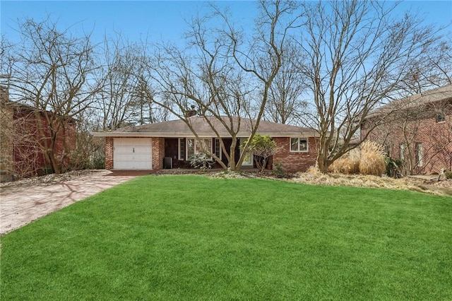 view of front facade featuring a garage, a front yard, brick siding, and driveway