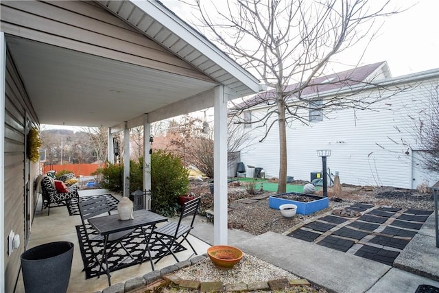 view of patio / terrace featuring a fire pit