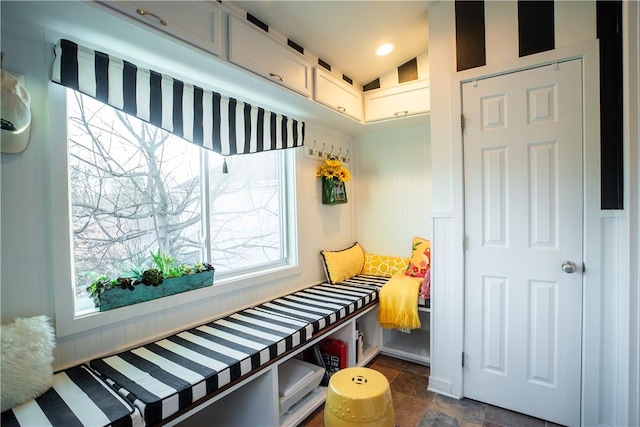 mudroom featuring vaulted ceiling