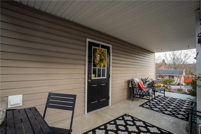 entrance to property featuring a patio area