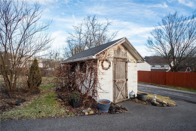 view of shed with fence