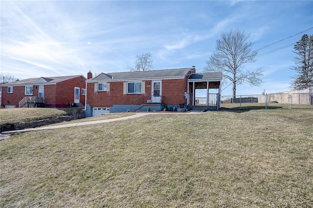 view of front of house with a gate, fence, a front lawn, and brick siding