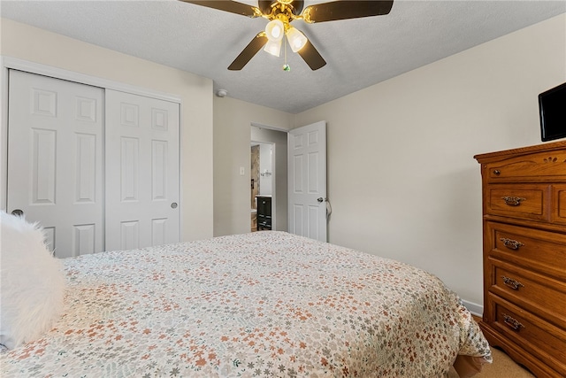 bedroom with a ceiling fan, a closet, and a textured ceiling