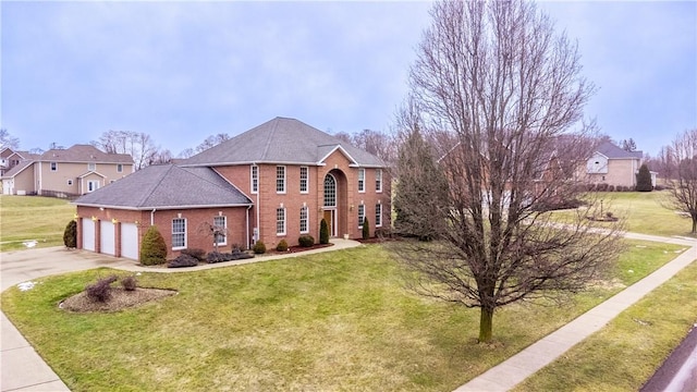 view of front of house featuring a garage, brick siding, a front lawn, and concrete driveway