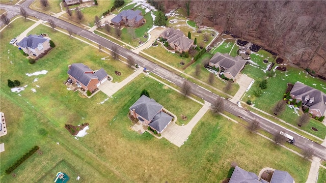 birds eye view of property with a residential view