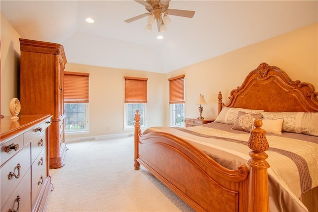 bedroom featuring baseboards, light colored carpet, ceiling fan, a tray ceiling, and recessed lighting