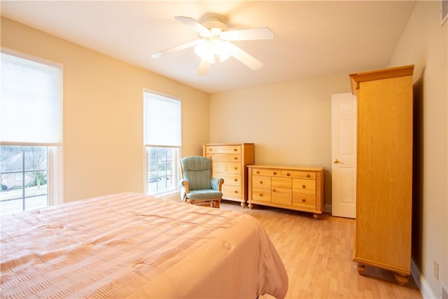 bedroom featuring light wood-type flooring and ceiling fan