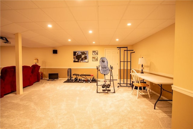 exercise room featuring recessed lighting, baseboards, a paneled ceiling, and carpet