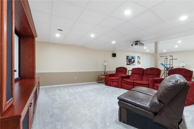 carpeted living area featuring baseboards, recessed lighting, and visible vents