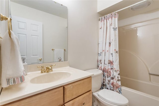 full bathroom featuring visible vents, toilet, vanity, and shower / tub combo with curtain