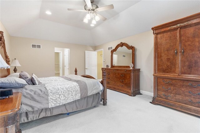 bedroom with ceiling fan, visible vents, connected bathroom, and light carpet