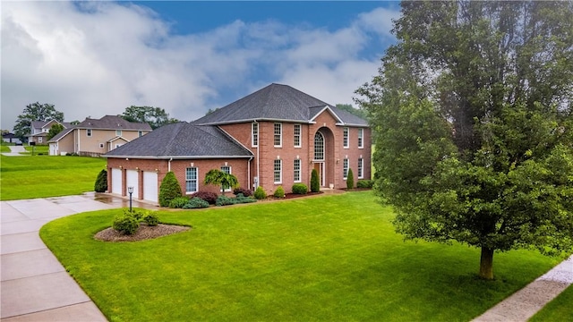 206 Fox Hollow Dr, Center Twp But, PA 16001 - view of front of house with brick siding, a garage, driveway, and a front yard