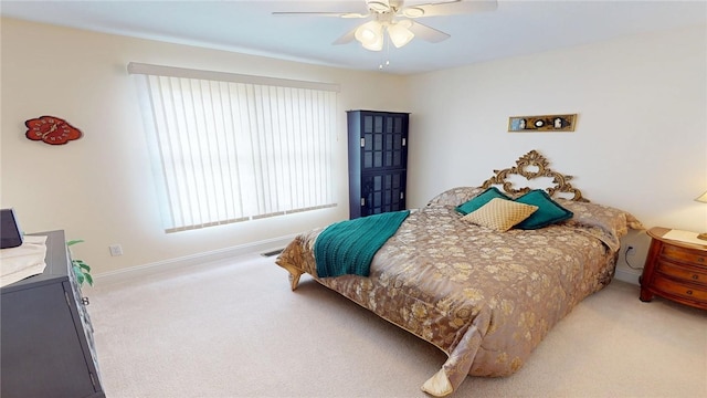 bedroom featuring carpet floors, ceiling fan, and baseboards