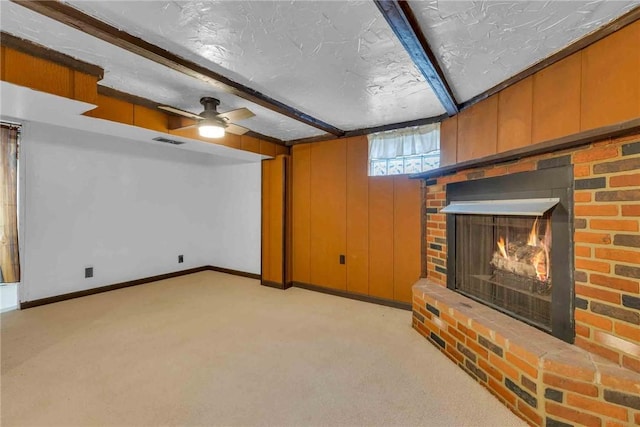 129 Birch St, Brighton Twp, PA 15009 - unfurnished living room with light carpet, beamed ceiling, a brick fireplace, and baseboards