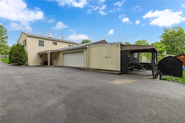 129 Birch St, Brighton Twp, PA 15009 - view of front of house with an attached garage and asphalt driveway