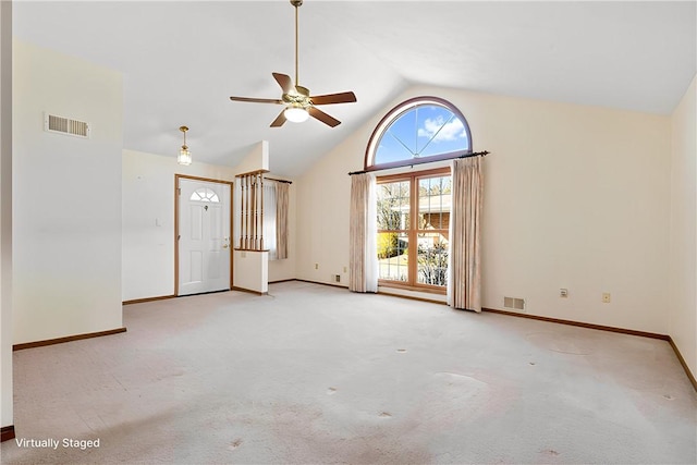 carpeted empty room featuring a ceiling fan, visible vents, high vaulted ceiling, and baseboards