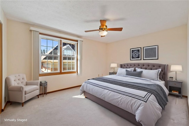 bedroom with a textured ceiling, carpet, and baseboards