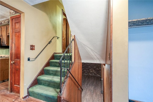 staircase with wood finished floors