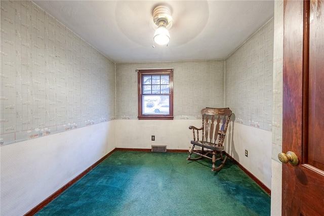 unfurnished room featuring baseboards, visible vents, and carpet flooring