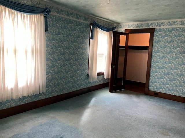 225 Country Club Rd, Penn Twp But, PA 16002 - unfurnished bedroom with wallpapered walls, baseboards, and carpet flooring