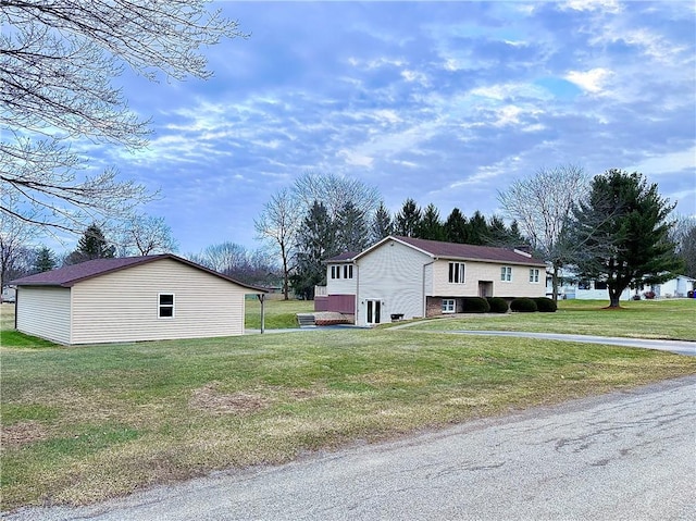 view of side of home with a lawn