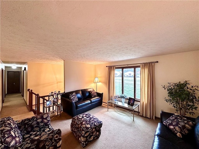 carpeted living area with a textured ceiling