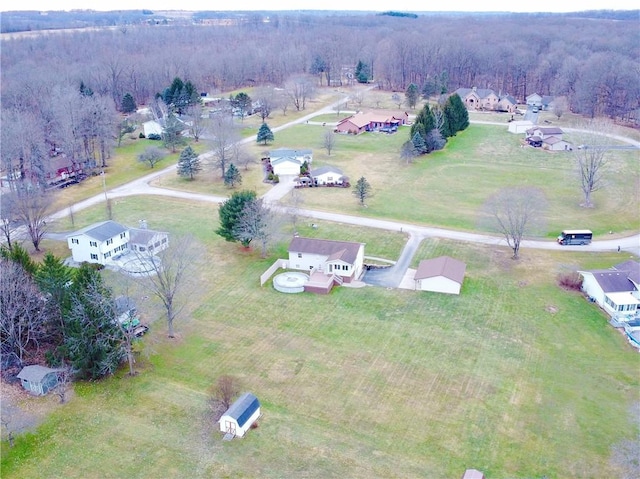 drone / aerial view featuring a forest view