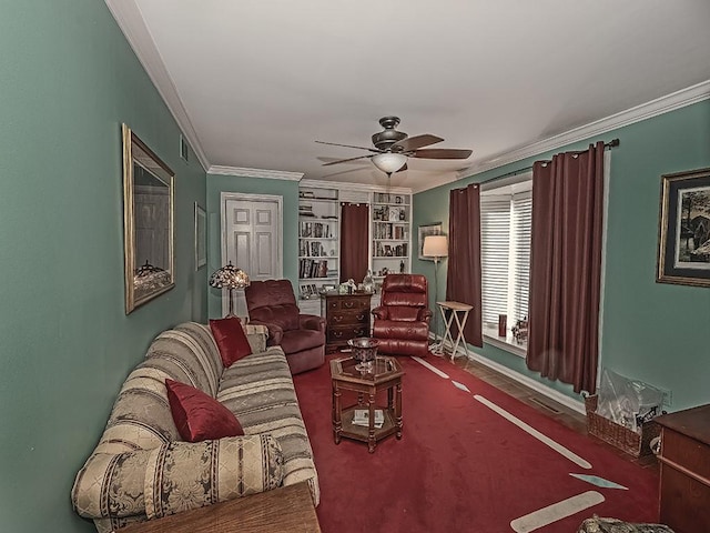 carpeted living room featuring ceiling fan and ornamental molding