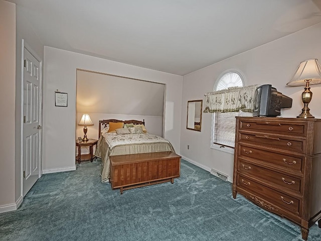 bedroom featuring dark colored carpet, visible vents, and baseboards